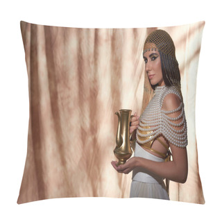 Personality  Stylish Woman In Egyptian Attire And Pearl Top Holding Golden Jug On Abstract Background Pillow Covers