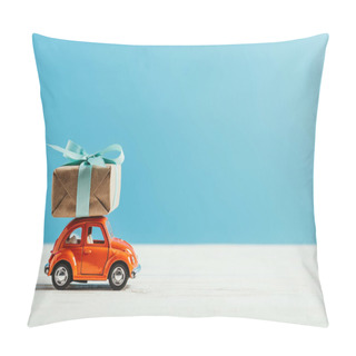 Personality  Side View Of Toy Red Car With Christmas Gift Box Riding On White Surface On Blue Background Pillow Covers