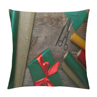 Personality  Flat Lay With Wrapped Christmas Present With Ribbon On Wooden Surface With Wrapping Papers, Envelope And Scissors Pillow Covers