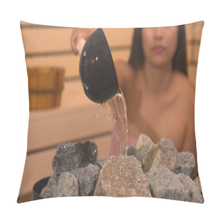 Personality  Woman Pouring Water To Heater Stones To Make Steam In Finnish Sauna. Stones As Necessary Equipment For Slightly Slower Evaporation Of Sauna Steam. Beautiful Lady Treating Herself With Spa. Pillow Covers