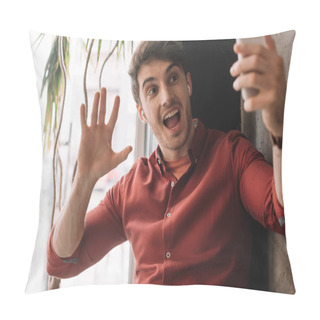 Personality  Man In Wireless Earphones Using Having Video Chat On Smartphone And Waving Hand Near Window Pillow Covers
