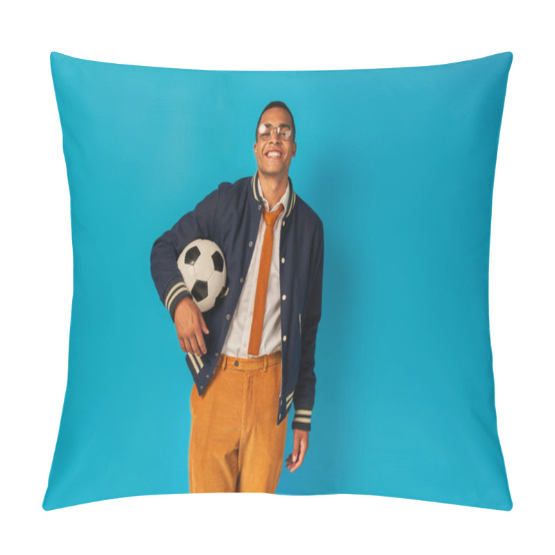 Personality  Pleased African American Student In Orange Pants, With Soccer Ball, Smiling At Camera On Blue Pillow Covers