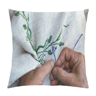 Personality  Hands Of An Elderly Woman Embroidering A Cross-stitch Floral Pattern On Linen Fabric. Embroidery, Handwork, Needlecraft Concept. Closeup Pillow Covers