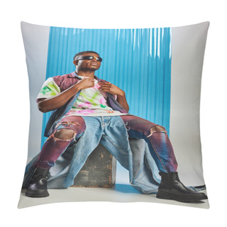 Personality  Full Length Of Trendy African American Model In Sunglasses, Colorful Denim Vest And T-shirt Sitting On Stone On Grey With Blue Polycarbonate Sheet At Background, Fashion Shoot, DIY Clothing Pillow Covers