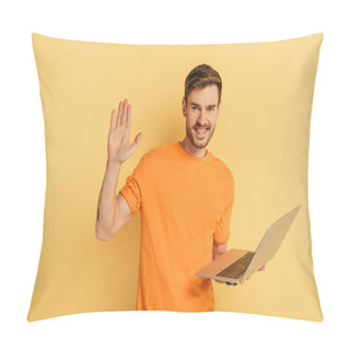 Personality  Happy Man Waving Hand At Camera While Holding Laptop On Yellow Background Pillow Covers