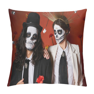Personality  Trendy Couple In Dia De Los Muertos Skull Makeup Looking At Camera On Red Backdrop With Carnations Pillow Covers