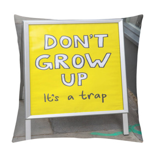 Personality  London, UK - May 7th 2021: A Funny Sign Outside The Entrance To A Shop In Central London, Telling Passers-by Dont Grow Up - Its A Trap. Pillow Covers
