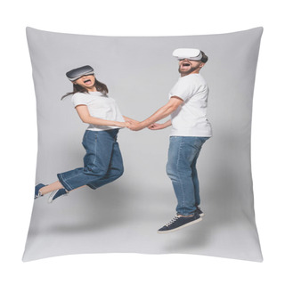 Personality  Excited Couple In Vr Headsets, Jeans And White T-shirts Holding Hands While Levitating On Grey Pillow Covers