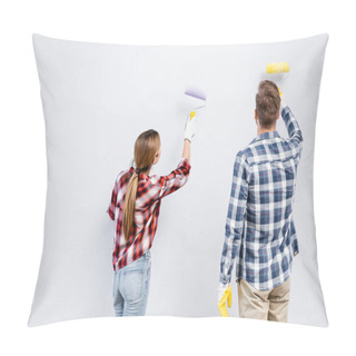 Personality  Back View Of Young Couple With Rollers Painting Wall At Home Pillow Covers