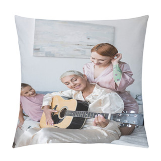 Personality  Smiling Woman Looking At Girlfriend With Acoustic Guitar Near Daughter On Bed  Pillow Covers