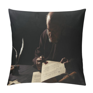 Personality  Monk Holding Wax Seal And Manuscripts In Darkness Isolated On Black Pillow Covers