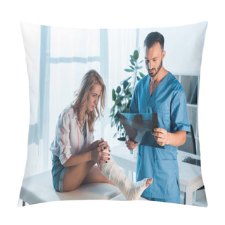 Personality  Handsome Bearded Orthopedist Holding X-ray Near Injured Woman In Clinic  Pillow Covers