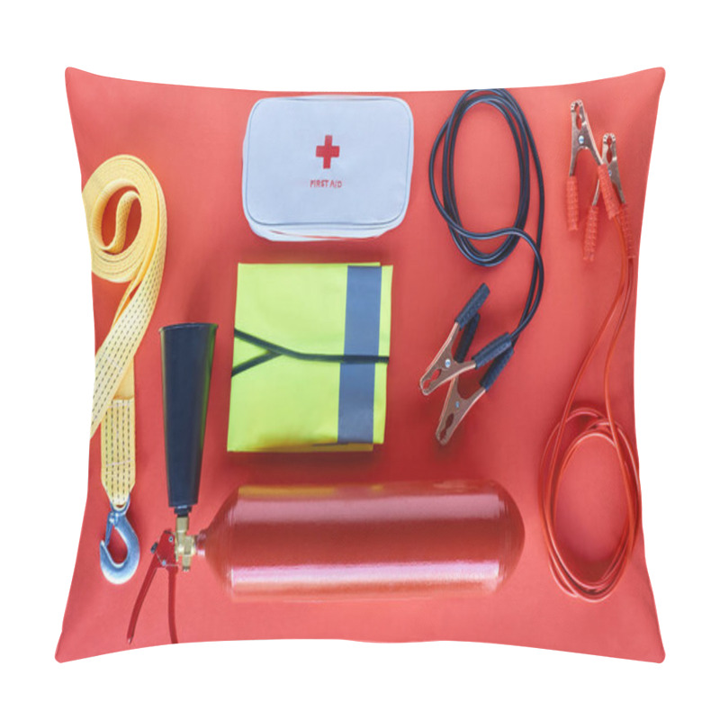 Personality  Top View Of Fire Extinguisher, First Aid Kit And Jump Start Cables On Red Background Pillow Covers