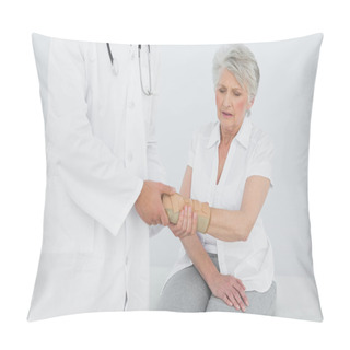 Personality  Male Physiotherapist Examining A Senior Woman's Wrist Pillow Covers