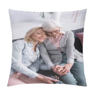 Personality  Smiling Woman Holding Hand Of Elderly Mother And Remote Controller On Couch  Pillow Covers