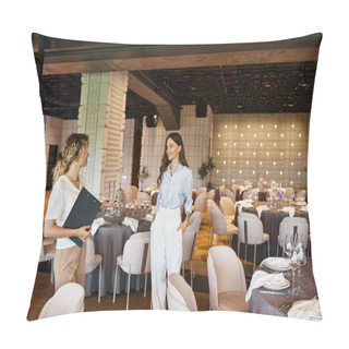 Personality  Event Coordinator With Clipboard Showing Modern Banquet Hall With Decorated Tables To Young Woman Pillow Covers
