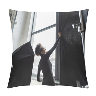 Personality  African American Content Manager In Black Turtleneck Pulling Curtain Near Window Near Softbox Reflector In Photo Studio Pillow Covers