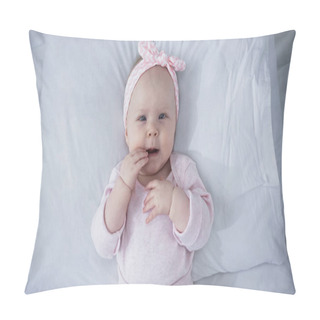 Personality  Top View Of Baby Girl In Headband With Bow Lying On Bed With White Bedding Pillow Covers