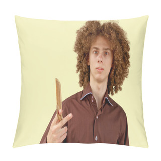 Personality  A Long-haired Curly-haired Guy In A Brown Shirt On A Beige Background Uses A Wooden Comb. Emotions Before A Haircut In A Hairdresser. Pillow Covers