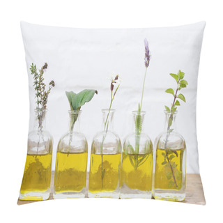 Personality  Bottle Of Essential Oil With Herbs Set Up On White Background Pillow Covers