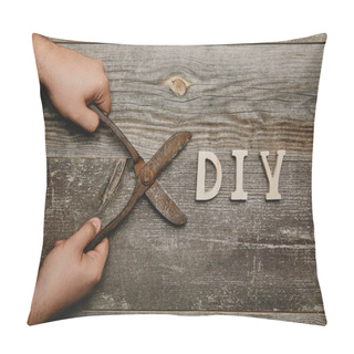 Personality  Partial View Of Man Holding Vintage Rusty Carpentry Scissors On Wooden Background With Diy Sign Pillow Covers