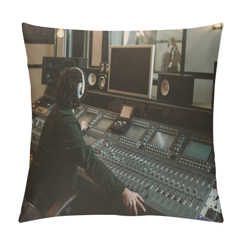 Personality  sound producer working at studio while recording song pillow covers