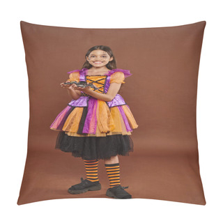 Personality  Cheerful Girl In Halloween Costume Holding Fake Spider And Standing On Brown Backdrop, Spooky Season Pillow Covers