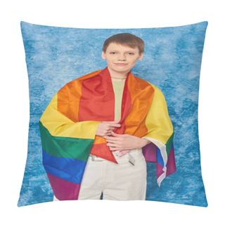 Personality  Portrait Of Young Queer Person Wrapped In Lgbt Flag Looking At Camera And Standing During Pride Month Celebration On Mottled Blue Background Pillow Covers