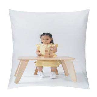 Personality  Asian Preschooler Girl In Yellow Dress Playing With Wooden Shapes On Grey Pillow Covers