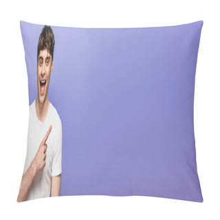 Personality  Panoramic Shot Of Cheerful Young Man Looking At Camera And Pointing With Finger Isolated On Blue Pillow Covers
