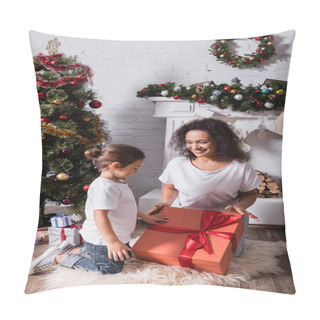 Personality  Mother With Daughter Touching Big Gift Box Near Fireplace And Pine At Home Pillow Covers