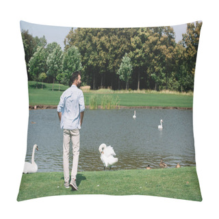 Personality  Back View Of Young Man Standing Near Pond With White Swans In Park Pillow Covers