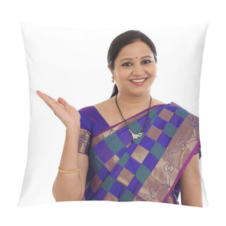 Personality  Happy Young Traditional Woman Showing Copy Space Against White Pillow Covers
