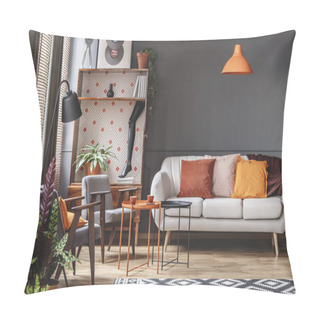 Personality  Orange Lamp Above Sofa In Vintage Living Room Interior With Plants Next To Grey Armchair Pillow Covers