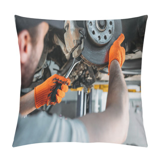 Personality  Selective Focus Of Professional Worker Repairing Car Without Wheel In Mechanic Shop Pillow Covers