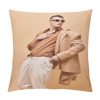 Personality  Fashion Shot Of Man In Beige Jacket And Shirt With Sunglasses And Hand Near Collar On Beige Backdrop Pillow Covers