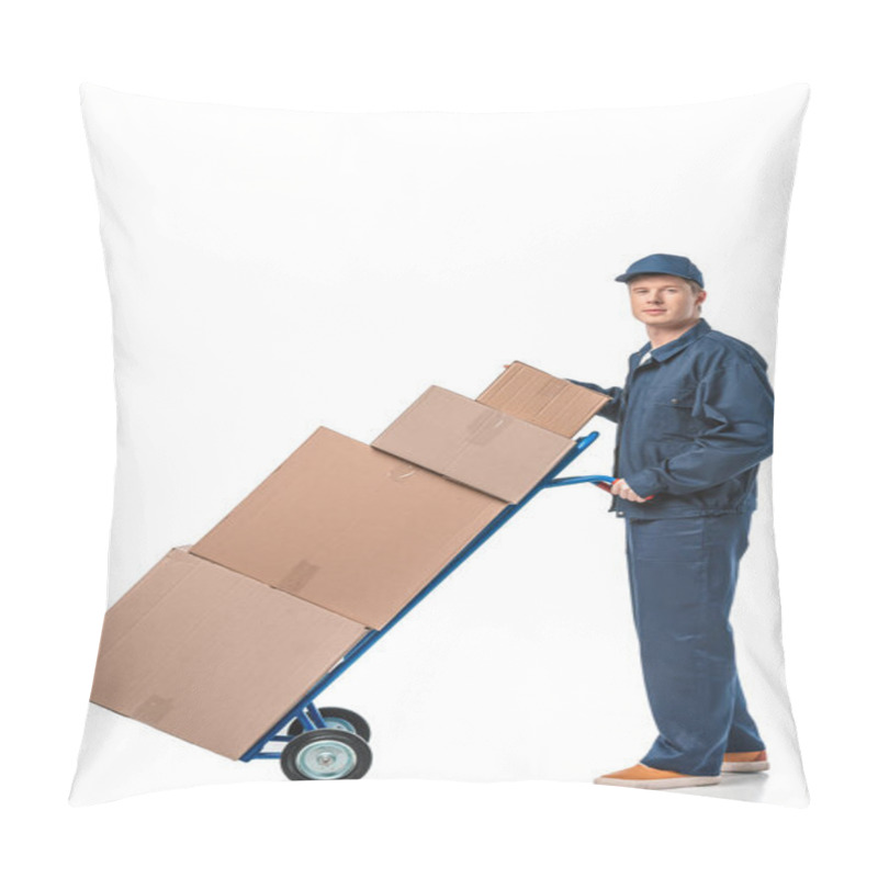 Personality  handsome mover in uniform looking at camera while transporting cardboard boxes on hand truck isolated on white pillow covers