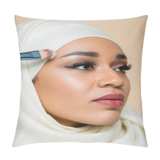 Personality  Portrait Of Young Muslim Woman In Hijab Applying Face Foundation With Cosmetic Brush Isolated On Beige Pillow Covers