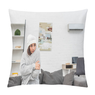 Personality  Freezed Young Woman In Warm Clothes Sitting On Couch At Home With Air Condition Hanging On Background Pillow Covers