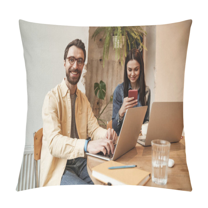 Personality  happy freelancer in eyeglasses using laptop near woman in cafe pillow covers