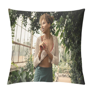 Personality  Positive Young African American Woman In Trendy Summer Knitted Top And Skirt Looking Away While Standing Near Green Plants In Garden Center, Stylish Woman Enjoying Lush Tropical Surroundings Pillow Covers