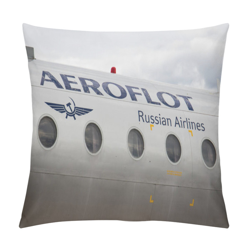 Personality  Riga, Latvia - June 1, 2023: Aeroflot Russian Airlines Logo And Title On The Fuselage Of An Passenger Airplane In A Bad Shape With Dark Clouds Pillow Covers