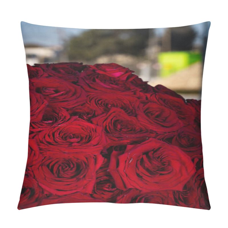 Personality  A stunning arrangement of red roses fills a vase, providing a visually striking display. pillow covers