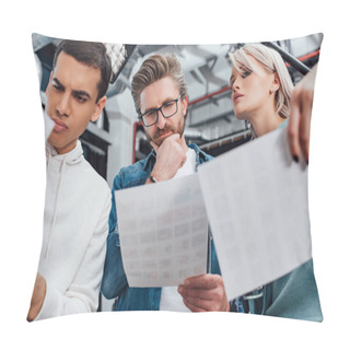 Personality  Low Angle View Of Pensive Creative Director In Glasses Looking At Photo Near Coworkers  Pillow Covers
