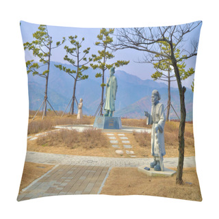 Personality  Samcheok City, South Korea - December 28, 2023: Sculptures Of Silla Era Men And Scholars Standing On A Hill In Lady Suro Memorial Park, Framed By Trees And Mountains In The Background. Pillow Covers