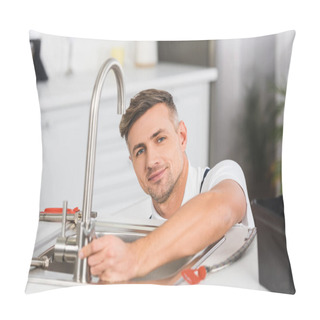 Personality  Smiling Adult Repairman With Spanner Repairing Faucet At Kitchen And Looking At Camera Pillow Covers