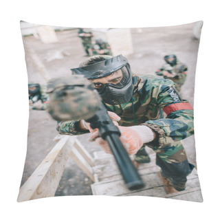 Personality  High Angle View Of Male Paintball Player Aiming By Marker Gun And Running On Staircase While His Team Standing Behind Outdoors  Pillow Covers