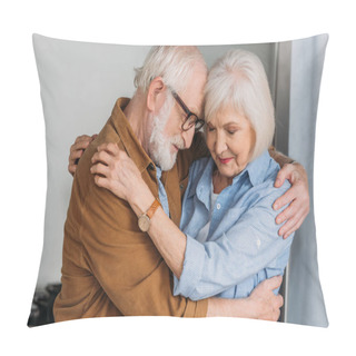 Personality  Happy Senior Couple With Closed Eyes Hugging Indoors Pillow Covers