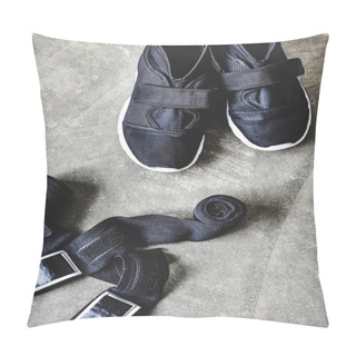 Personality  Close-up Shot Of Sneakers And Wrist Wraps On Concrete Surface Pillow Covers