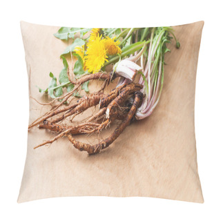 Personality  Young Burdock Roots With Tops And Flowers On A Wooden Background For Use In Folk Herbal Medicine. Pillow Covers